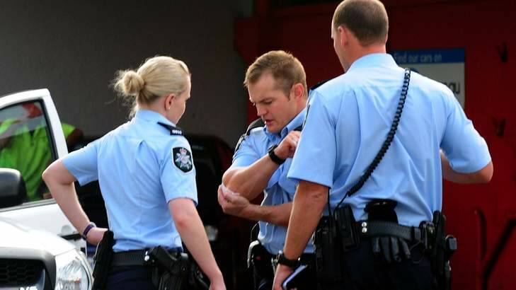 ACT police officers after a scuffle and arrest. Photo: Karleen Minney