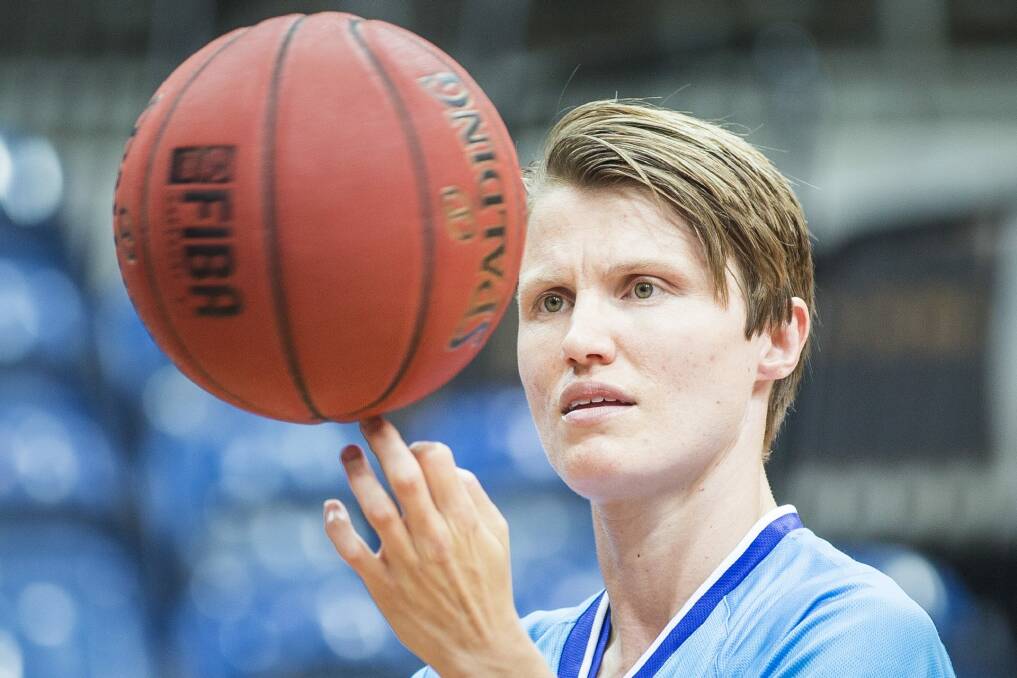 Canberra Capitals star  Jessica Bibby wants to play in the national Australian rules competition when it kicks off next year. Photo: Matt Bedford