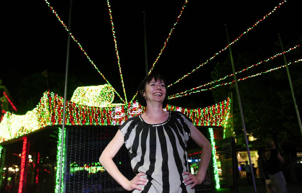 SIDS and Kids ACT chief executive Nathalie Maconachie among the Guinness World record attempt for the largest LED light image display. Photo: Melissa Adams