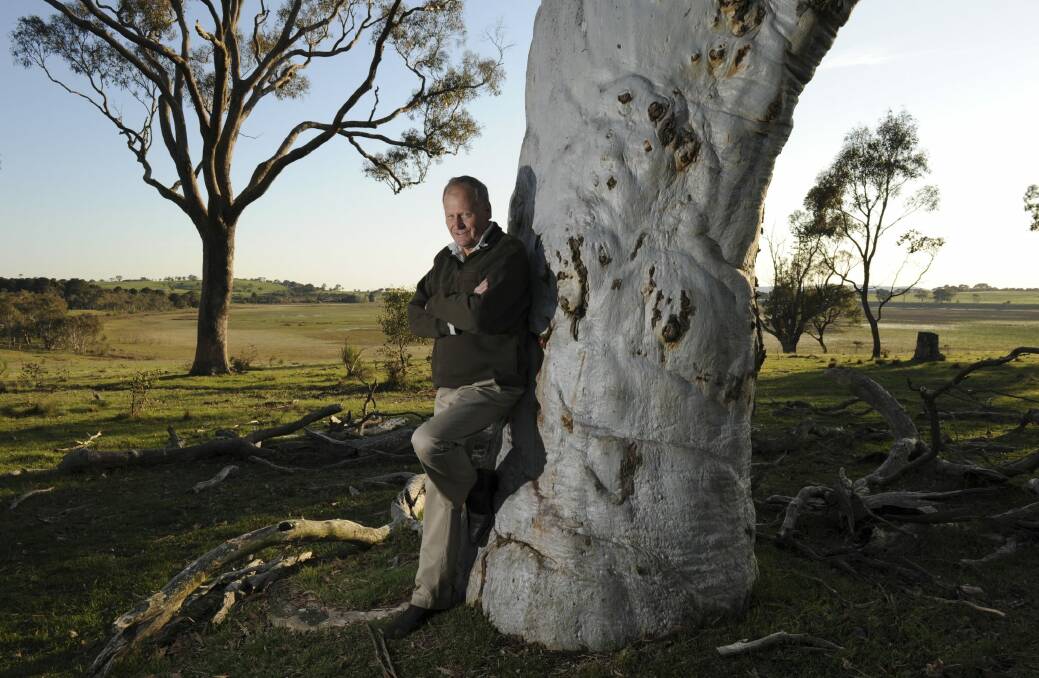 Robert Hunt among old trees, with Rowes Lagoon in the background. Photo: Graham Tidy