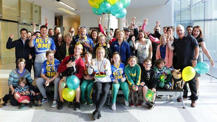 World BMX champion Caroline Buchanan returned to a welcome-home surprise at Canberra Airport on Wednesday. Photo: Zhenshi van der Klooster