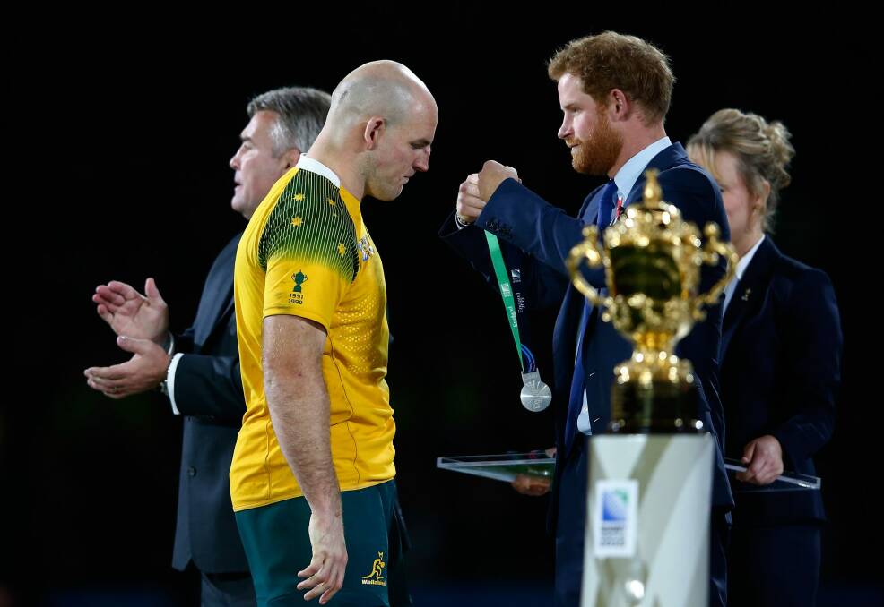 A gutted Stephen Moore gets his runners-up medal from Prince Harry. Photo: Shaun Botterill