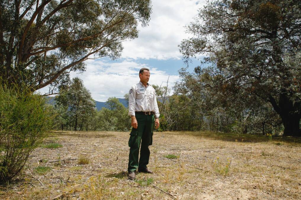 ACT parks and conservation service regional manager Brett McNamara stands at the site of his former house in Tidbinbilla, which was razed by the 2003 bushfires.  Photo: Sitthixay Ditthavong