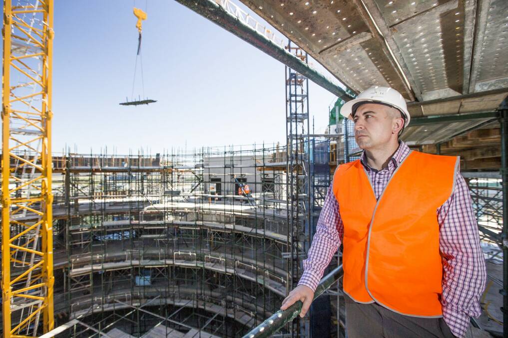  Zarko Danilov, project manager for a new motel under contraction at Canberra Airport tours the construction site. Photo: Matt Bedford