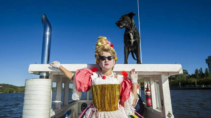 Centenary performer, Madame Bon Bon and Josie the dog, on board the Blue Fin boat on Lake Burley Griffin. Photo: Rohan Thomson
