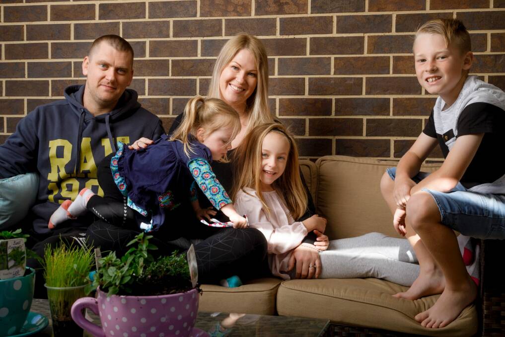 Erica Mitchell and her family are considering moving out of Canberra to a regional town as they struggle to cost with rising living expenses. L-R: Josh and Erica Mitchell with their children Sofia, 2, Aria, 6, and Phoenix, 9. Photo: Sitthixay Ditthavong