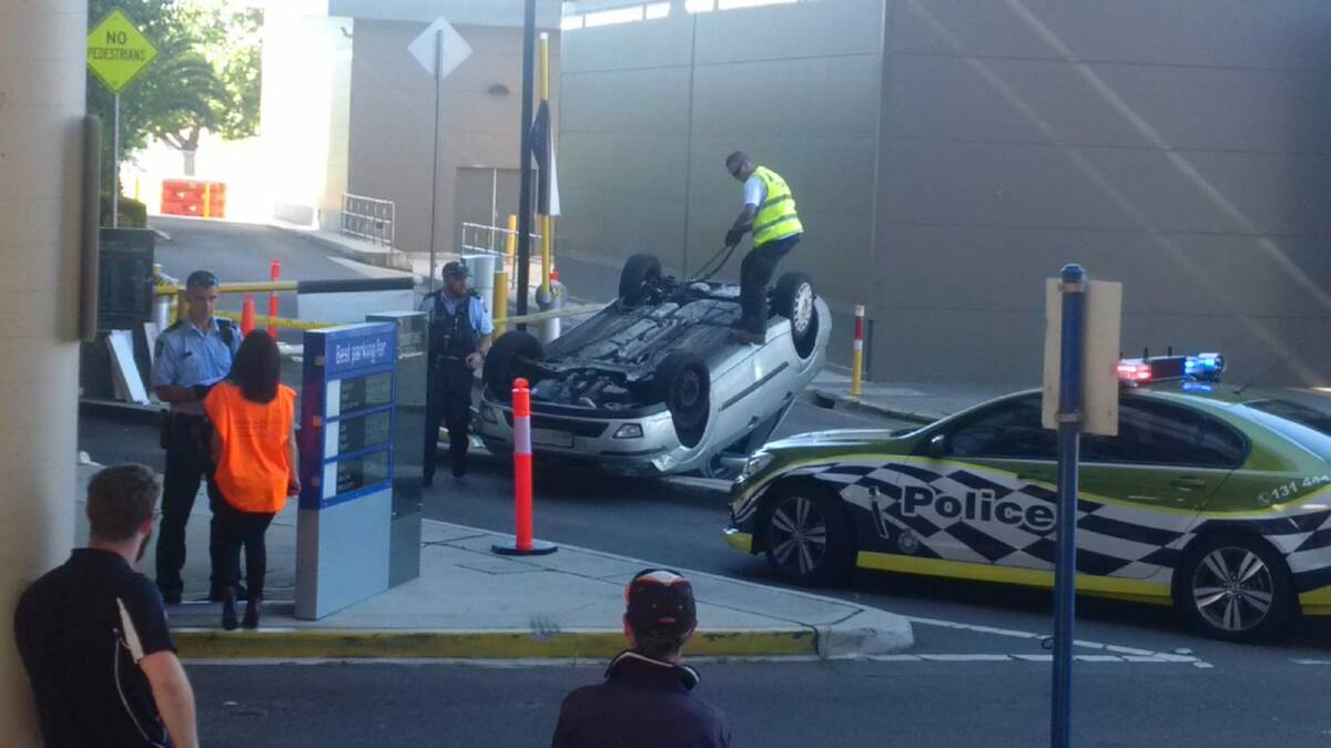 A car flipped in the Belconnen Westfield car park on Friday, December 4, 2015.