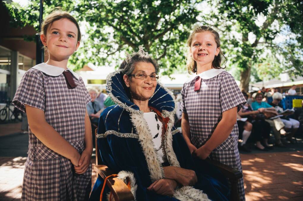 Queen of Curtin Viola Kalokerinos with two of her loyal subjects, Holy Trinity year 2 students Maggie Kay and Maya Mackellar. Photo: Rohan Thomson