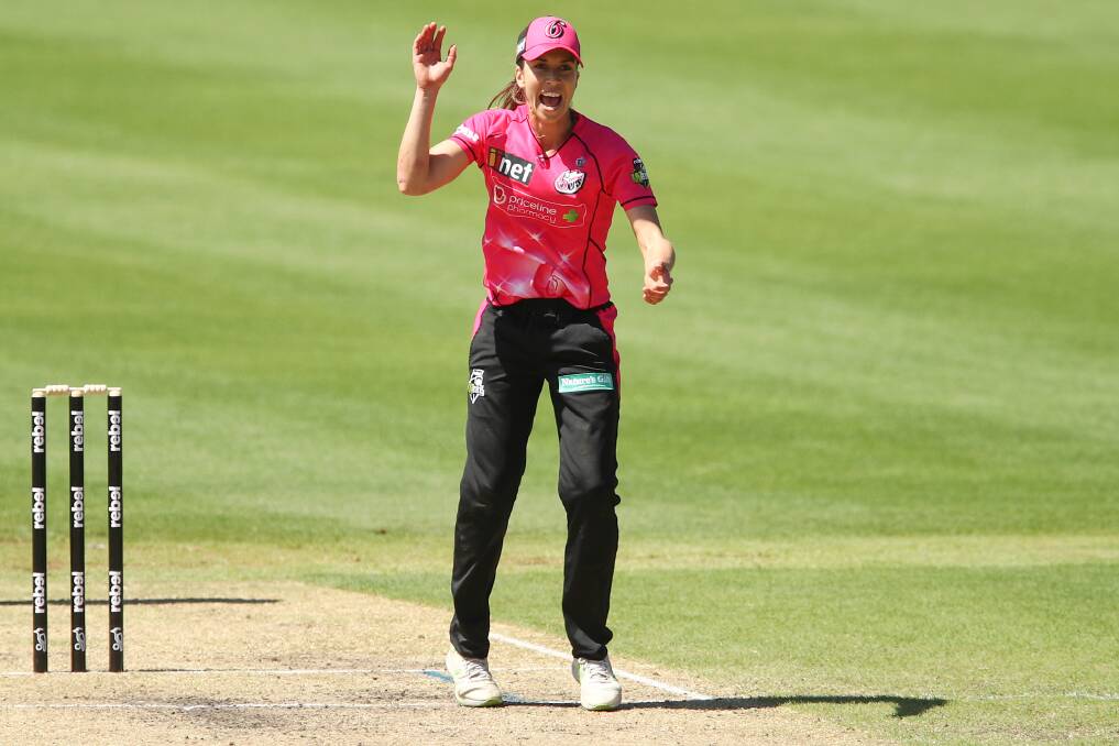 Erin Burns will be in Sixers colours again next season. Photo: AAP