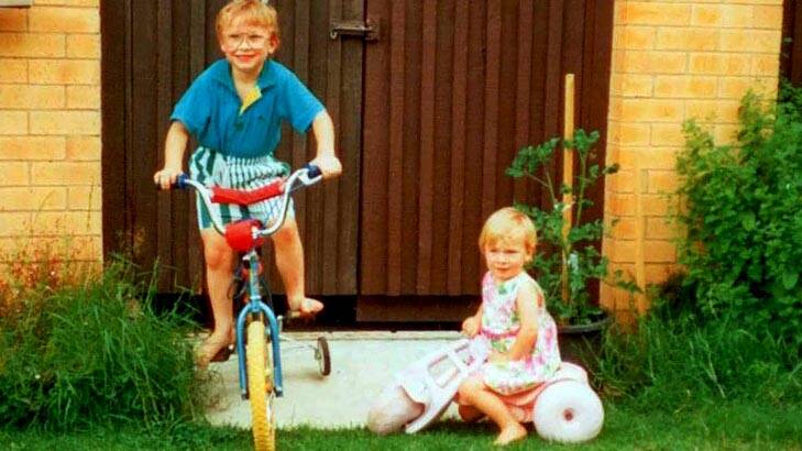 On her bike ... Caroline Buchanan on her tricycle with brother Sam.