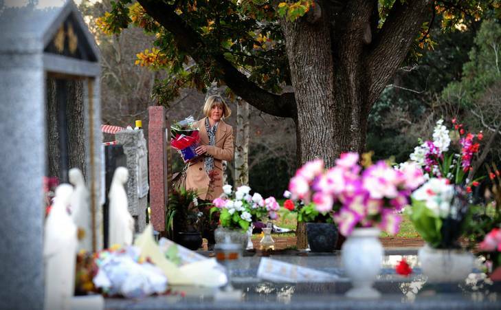Kathy McIntosh of Garran visits the grave of her sister Chrissy on her birthday. Photo: Karleen Minney