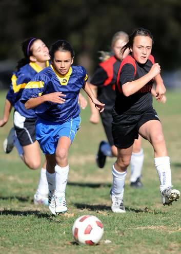 Game on: Primary school soccer at Wanniassa District Playing Fields. Photo: Gary Schafer GCS