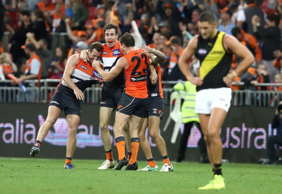 Out of jail: Jeremy Cameron and teammates celebrate the GWS Giants' comeback win last month. Photo: Getty Images