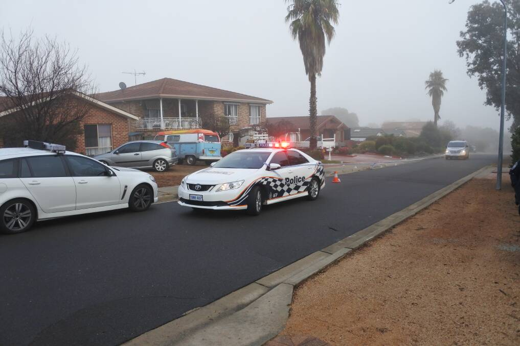 Police have cordoned off part of Carter Crescent in Calwell after shots were fired in a bikie-related incident on Thursday night. Photo: Blake Foden