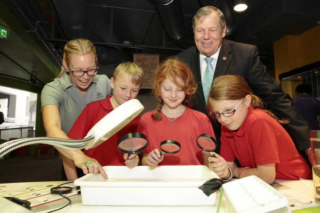  Murray Darling Basin Authority program officer Emma Hampton, left rear, shows different river life to Bob Baldwin, Parliamentary Secretary to the  Minister for Environment, with, front from left, Gilmore Primary School year 4 student Linkin Webster, year 5 student Taylah Hallam and year 5 student Ebony Page  at the Murray Darling Basin Authority exhibition at Questacon.   Photo: Jeffrey Chan