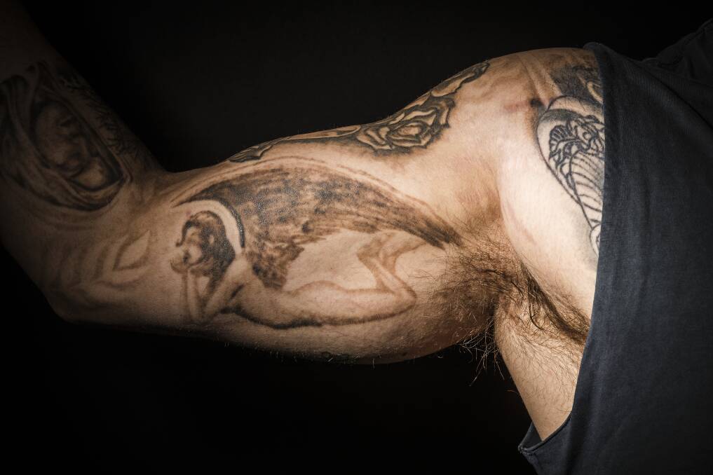 Anthony Onorato's 'ugly angel' was the first of many disappointing tattoos on his right arm. Photo: Sitthixay Ditthavong