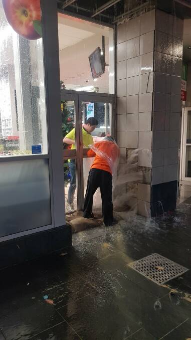 Rain pouring out of the walls at Woolworths Town Hall. Photo: James Lemon