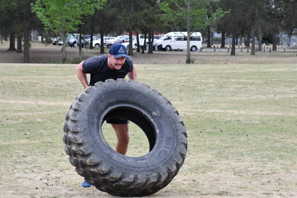 Jarrod Croker flipping tyres at pre-season training. Photo: Raiders Media
