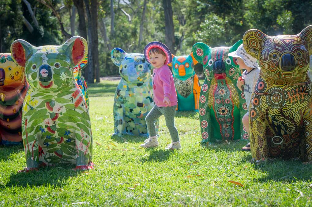 Nora Millard, 3, plays among the statues before they're scattered around Canberra. Photo: Karleen Minney