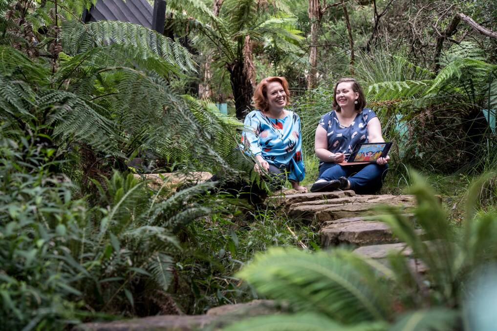 Our Bush Capital is a 32-page children's book written by Samantha Tidy (left) and illustrated by  Juliette Dudley. They are pictured at the Australian National Botanic Gardens. Photo: Karleen Minney