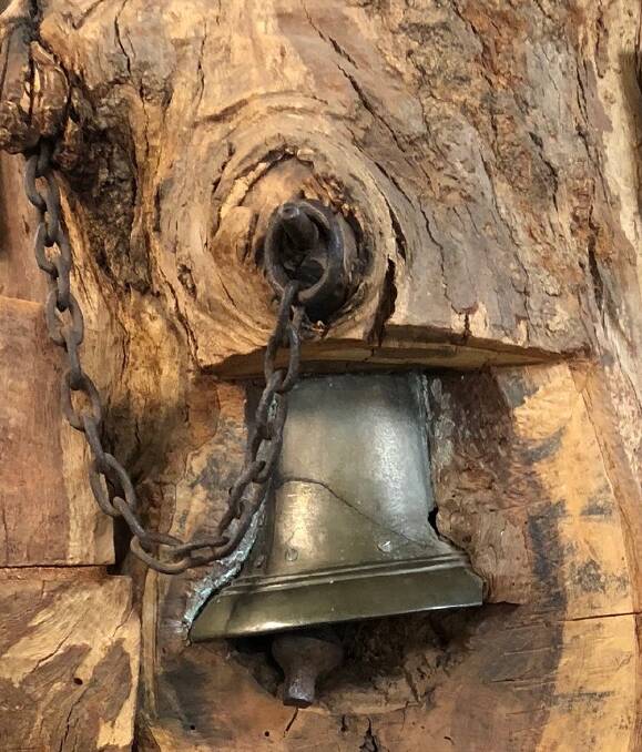 A bell embedded in a tree stump in Singleton, NSW. Photo: George Pietrzak