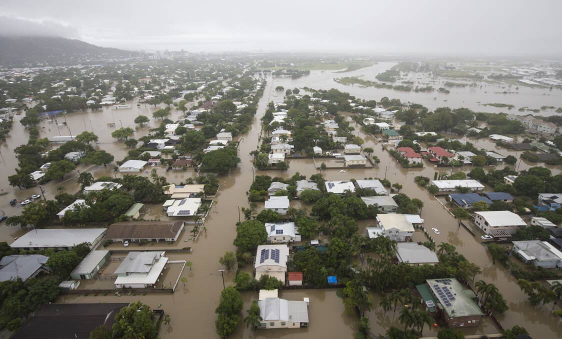 Houses are inundated in Townsville on Monday. Photo: Dave Acree - AAP