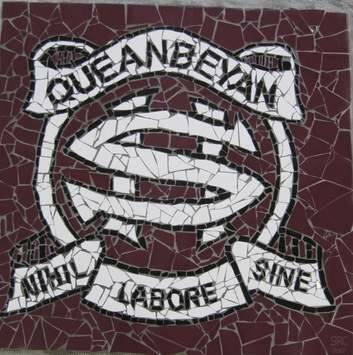 Queanbeyan High School Crest, done as a mosaic by kids at the school and erected above the stage in the hall. Photo: Karleen Minney