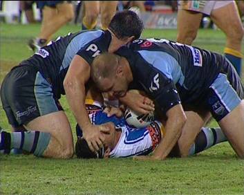 Paul Gallen grabs at the head bandages of Anthony Laffranchi in an incident that led to some commentators to call for him to be criminally charged. Photo: Fox Sports