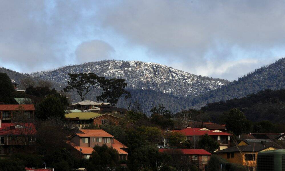 Cold weather brings snow to the Brindabella mountains, as seen from Gordon. Photo: Melissa Adams
