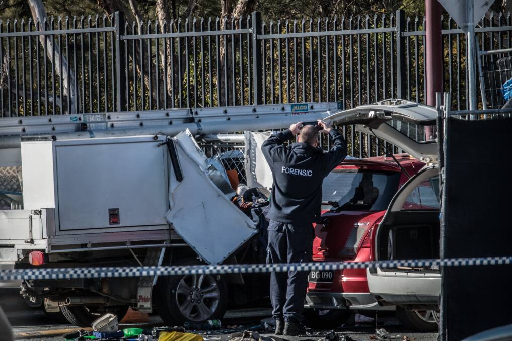 ACT police officers, forensic staff and detectives attend the scene on Friday morning.  Photo: Karleen Minney