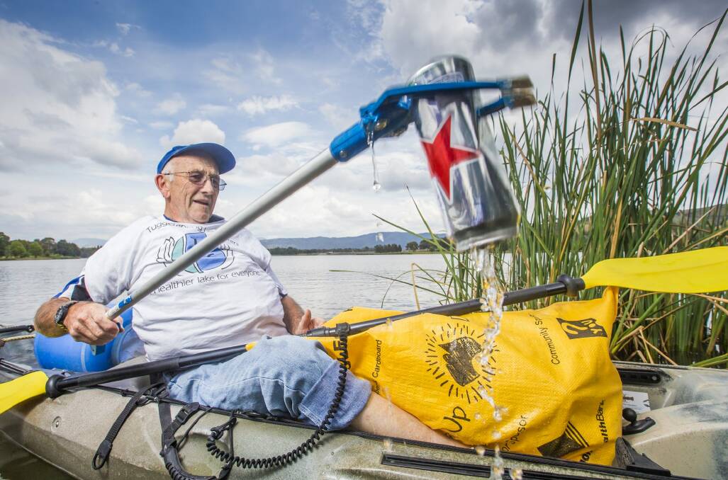Tuggeranong Lake Carers Group member Bill Perry uses his kayak to remove rubbish from the lake.

Canberra Times photo by Matt Bedford Photo: Matt Bedford 