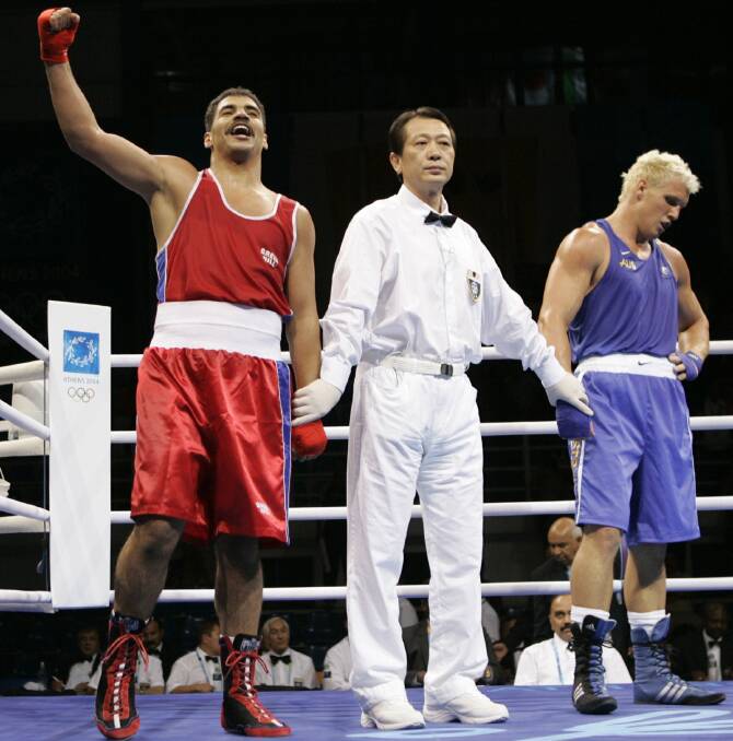 Australian boxer Adam Forsyth, right, after losing the heavyweight boxing quarter finals in the 2004 Athens Summer Olympic Games.