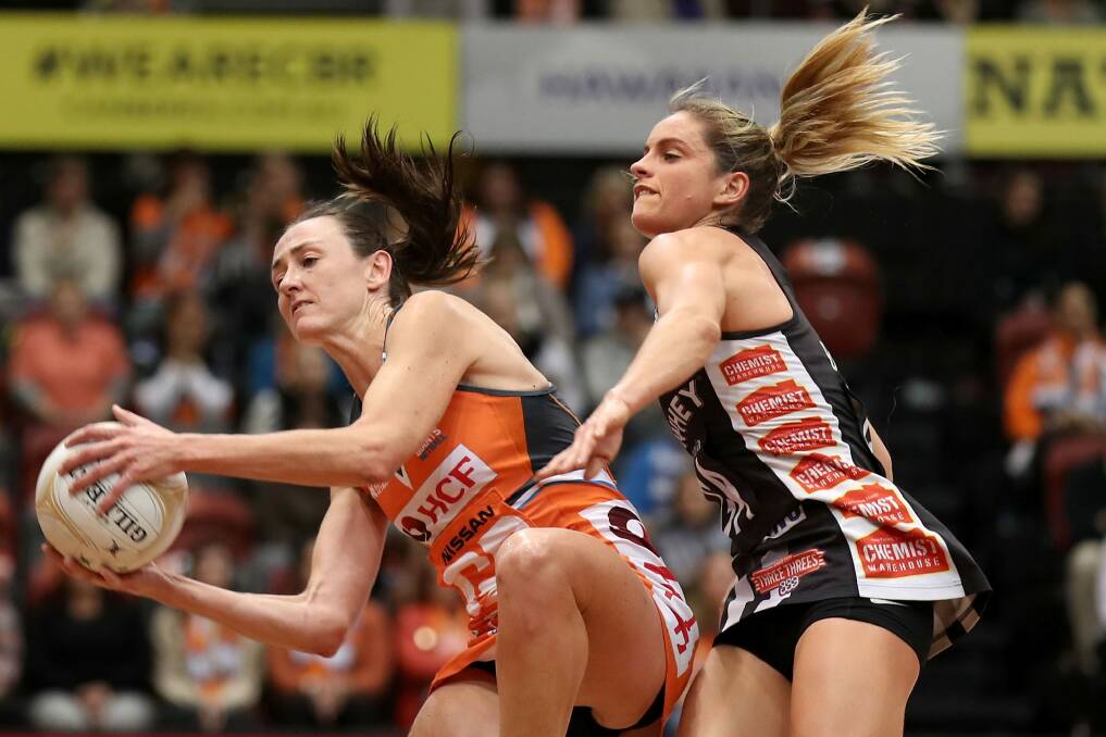 Back in orange: Bec Bulley of the Giants wins the ball under pressure from Shae Brown of the Magpies during the Super Netball major semi in early June. Photo: Getty Images