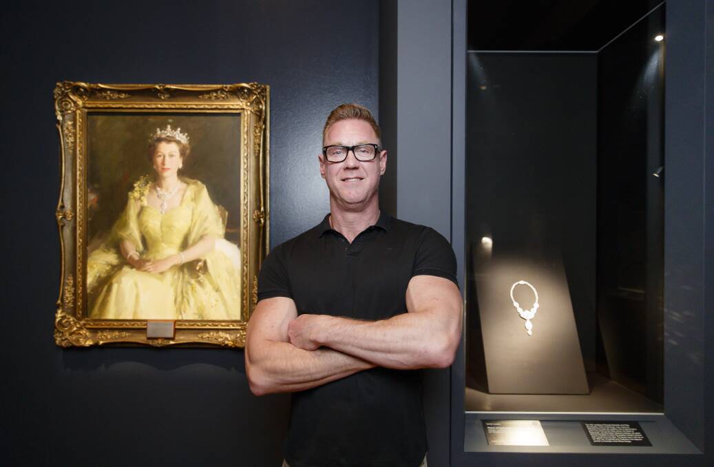 National Gallery of Australia's Adam Worrall with a piece from the Queen's personal collection.  Photo: Sitthixay Ditthavong