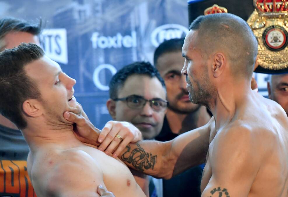 Fired up: Jeff Horn and Anthony Mundine clash in Brisbane. Photo: AAP