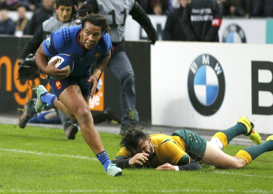 Teddy Thomas escapes Adam Ashley-Cooper to score for France. Photo: Reuters