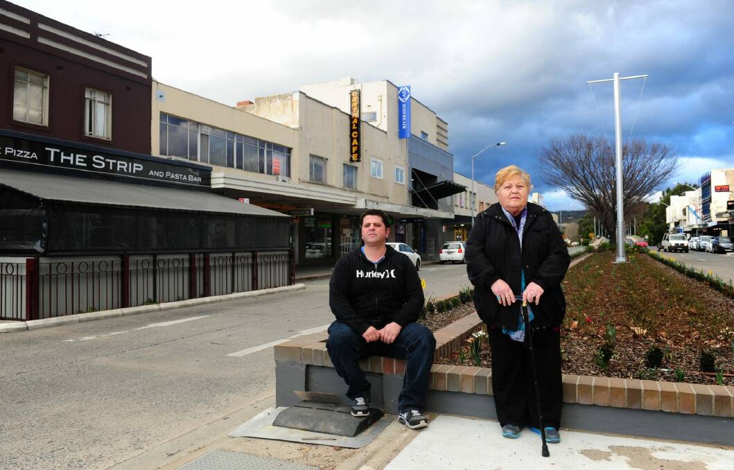   John Zafiris and his mother Vassilika outside the Monaro street property The Strip  Woodfire Pizza and Pasta Bar, previously the Old Paragon Cafe which Mrs Vassilika has owned since 1964. Photo: Melissa Adams