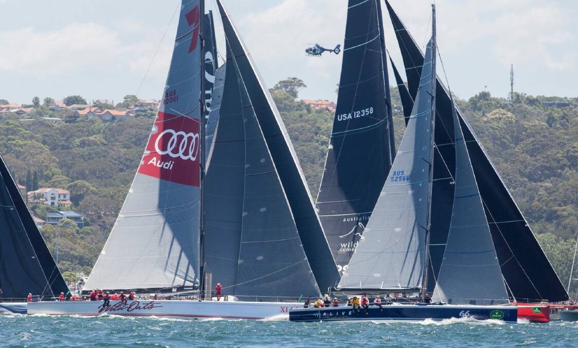 From left: Wild Oats battles with Alive and Comanche at the start of the Sydney to Hobart. Photo: Daniel Forster