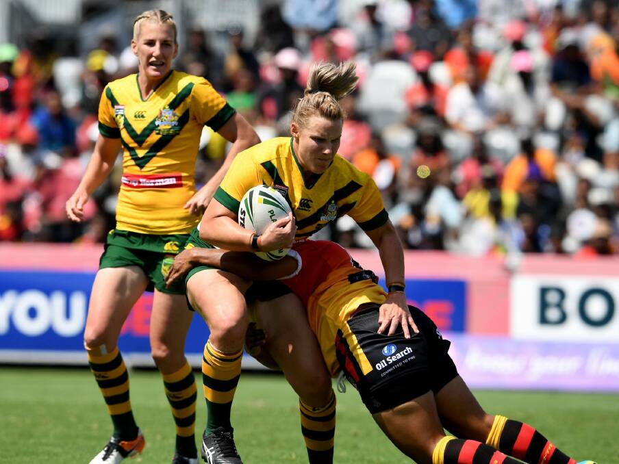Strong run: Renae Kunst is tackled during Australia's dominant win over Papua New Guinea. Photo: NRL imagery