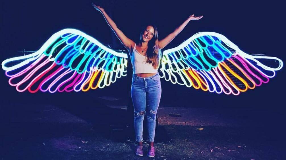 Pose with Neon Angel Wings at this year's Enlighten. Photo: Supplied