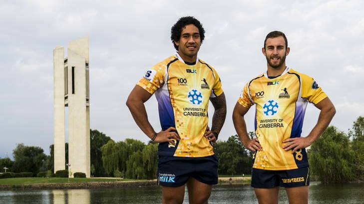 Brumbies' Joe Tomane and Nic White show off the Centenary jumpers by the lake on Tuesday. Photo: Rohan Thomson