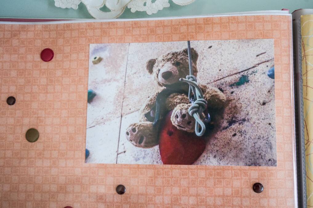 Theodore the bear rock climbing on behalf of Dainere in her final months. Photo: Karleen Minney