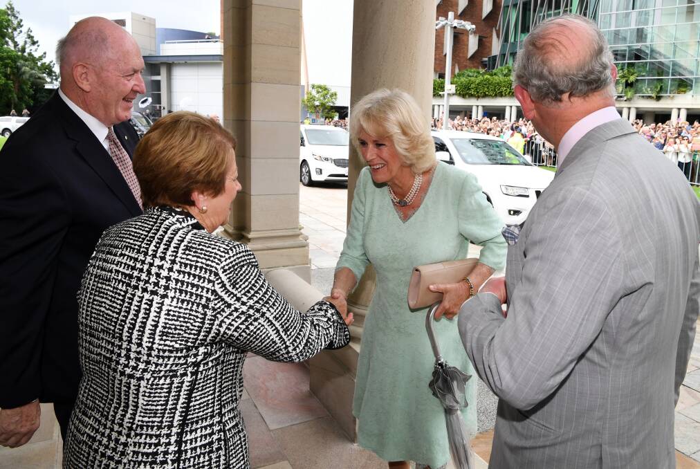 Prince Charles and the Duchess of Cornwall are greeted by the Governor General Sir Peter Cosgrove and his wife Lynne. Photo: AAP/Dan Peled