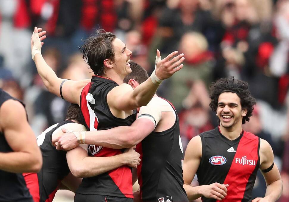 Joe Daniher celebrates after kicking one of his five goals against Carlton. Photo: Getty Images