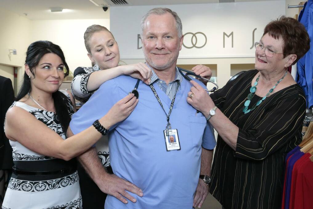 Calvary Hospital's senior staff specialist for emergency medicine, Dr Glenn Verheul, front, gets done up for the fashion parade by (rear from left), makeup artist Linda Guetaya, Lara Brown from Bloom Classics and Calvary Hospital Auxiliary president Daphne Ashley.  Photo: Jeffrey Chan.