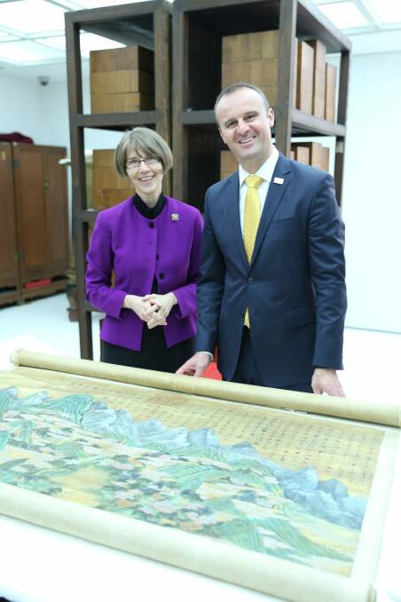 Chief Minister Andrew Barr and National Library of Australia director-general Anne-Marie Schwirtlich with one of the works. Photo: Supplied