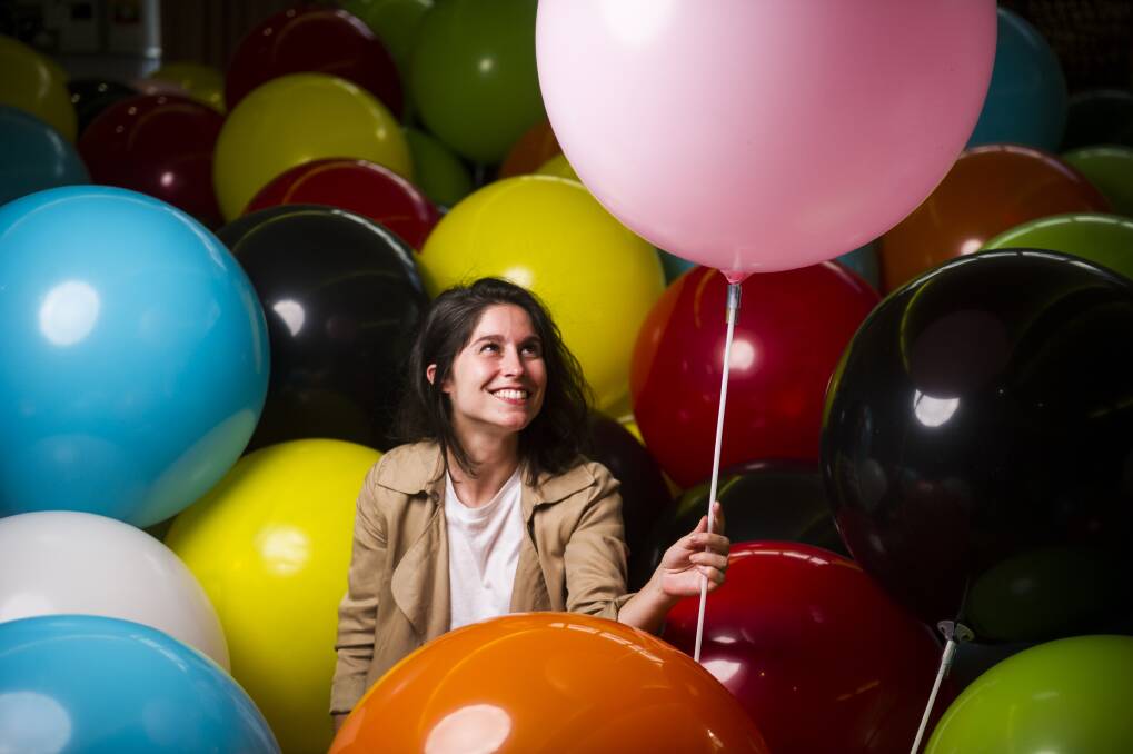 Artist Anne Ouellette from Daily tous les jours within the balloon installation that will fill up City Hill on Thursday. Photo: Dion Georgopoulos
