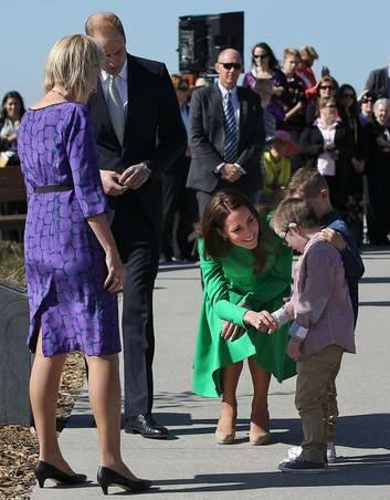 Royal encounter: Catherine, Duchess of Cambridge, greets twin brothers Oliver and Sebastian Lye, at the National Arboretum in Canberra. Photo: Alex Ellinghausen