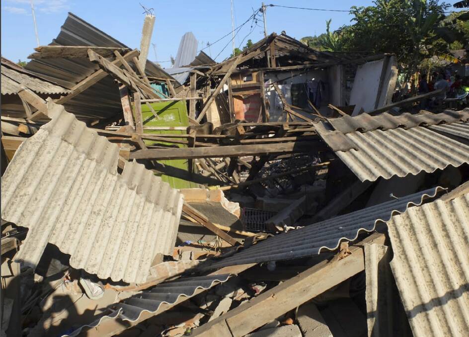 Houses damaged by an earthquake in North Lombok, Indonesia on Monday.  Photo: AP