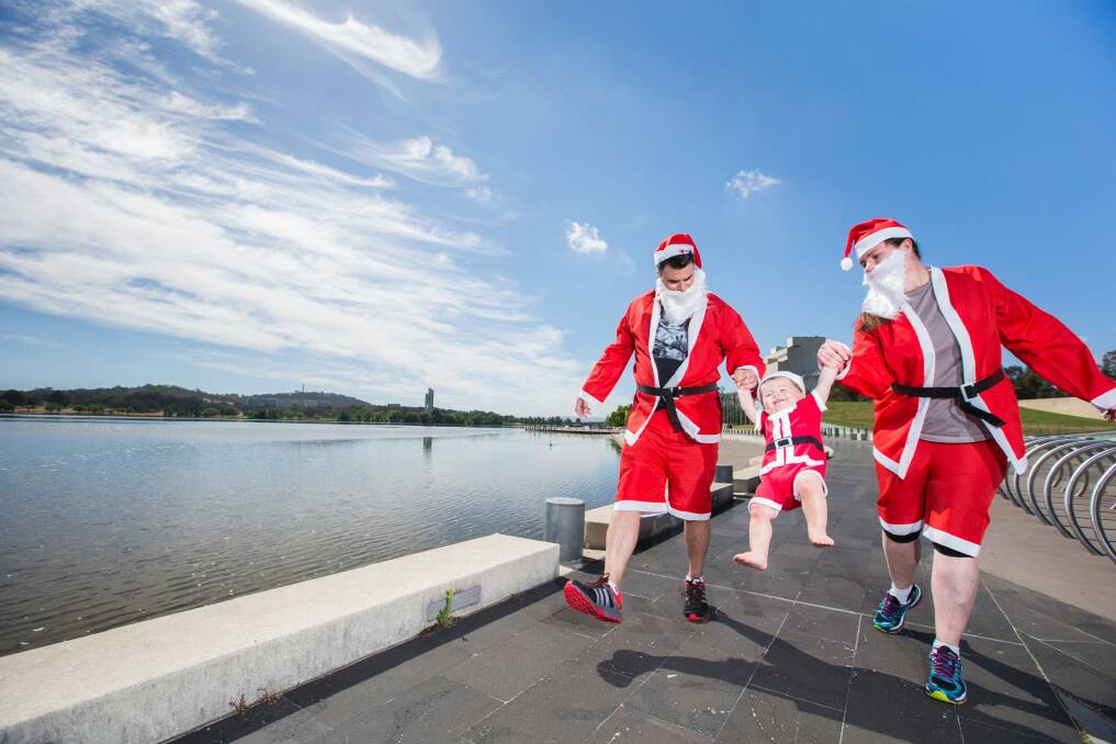 Mhanda and Ryan Vanengelen with son Jett will participate in the Canberra Variety Santa Fun Run on Sunday on the shore of Lake Burley Griffin with a squadron of Ms Vanengelen's Australian Defence Force Academy cadets. Photo: Matt Bedford